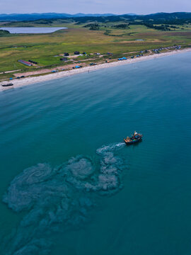 Aerial view of trawler fishing near coast in Lukin bay