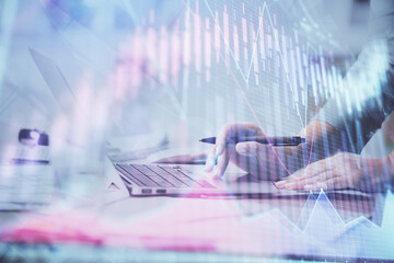 Multi exposure of woman hands typing on computer and financial chart hologram drawing. Stock market analysis concept.