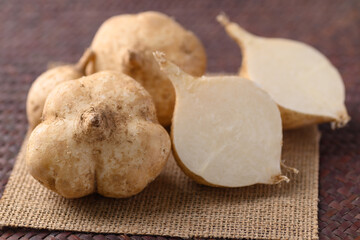 Fresh jicama or yam bean, Jicama can be eaten raw or cooked, The taste are crisp, juicy, moist, and slightly sweet