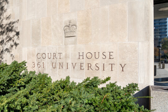 Toronto, Canada - October 28, 2020: Toronto Courthouse sign on the wall is seen on University Avenue in Toronto. It is a branch of the Ontario Superior Court of Justice and is used for criminal trials