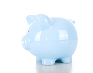 A blue piggy bank with the back facing the camera on a white background