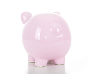 A pink piggy bank with the back facing the camera on a white background