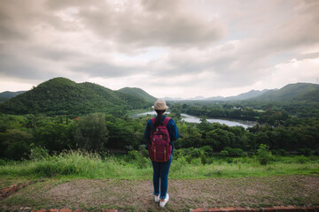 Fototapeta premium Happy young asian girl at Kang Kra Chan National Park Thailand