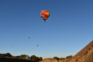 Flying air balloons in the air at the pyramids of Teotihuacan, Mexico. 