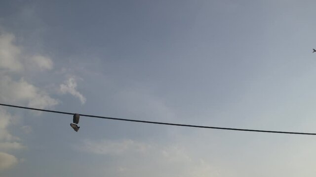 an Airplane moving through a different frame in Tehran the capital of Iran. made by Canon C100 mark II