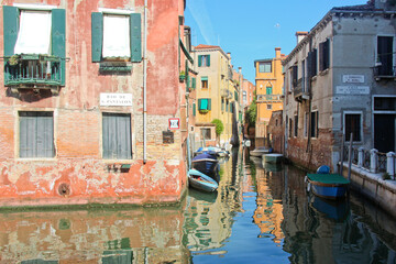 Fototapeta na wymiar Morning reflection in Venice canal, Italy. No people