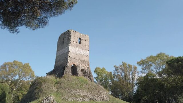 Passing by The tower Torre selce from the appian way on a sunny day