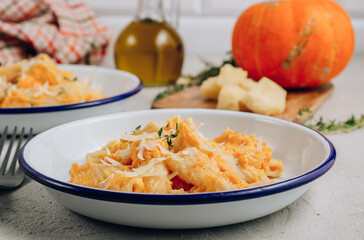 Creamy roasted butternut pumpkin tortiglioni pasta with parmesan cheese and thyme.