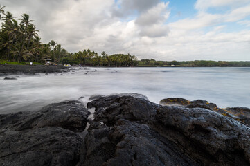 Long exposure of the Punaluu black sand beach in Big Island, Hawaii.
