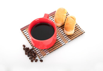 Hot coffee and bread and a handful of coffee beans on white background