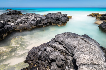 Long exposure of the Magic sands beach in Big Island, Hawaii.