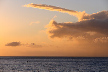Stand up paddle on Kaanapali beach right before sunset. Maui, Hawaii.
