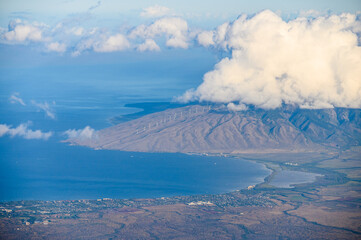 Wind turbines and the Maui coastline seen from Haleakala National Park. Maui, Hawaii.