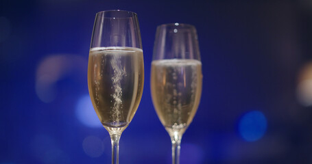 Fototapeta na wymiar Glass of the Champagne over the city night view