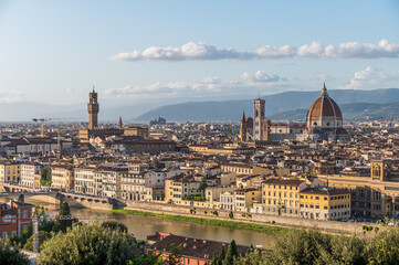 Fototapeta na wymiar Santa Maria del Fiore and Piazza della Signoria towering over the Florence cityscape.