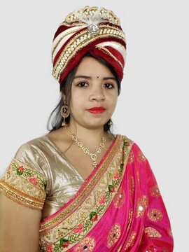 Turban or wreath worn by Indian woman in sari symbolising independent woman concept.