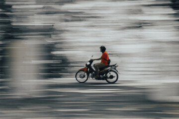 Fototapeta na wymiar Person riding a bike