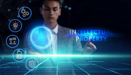 Business, technology, internet and network concept. Young businessman thinks over the steps for successful growth: Intellectual property