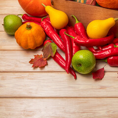 Fall decor with squash, red hot chili peppers, apples