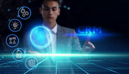 Business, technology, internet and network concept. Young businessman thinks over the steps for successful growth: CRM