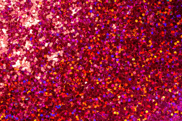 Full frame macro abstract background of sparkling red color glitter texture, with copy space