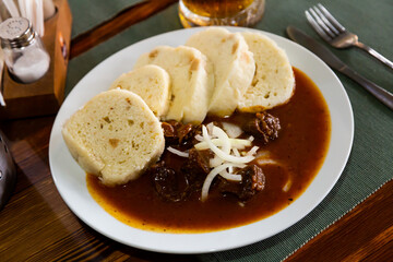 Tasty beef goulash with potato dumplings. Czech cuisine