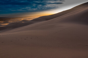 Naklejka na ściany i meble Sunset on The Dune Field of Great Sand Dunes National Park, Colorado, USA