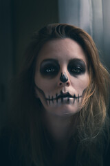 portrait of a woman with skull makeup 