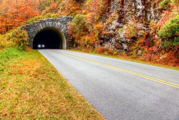 A landscape of a car tunnel on the Blue Ridge Parkway in Autumn in North Carolina. Copy space.