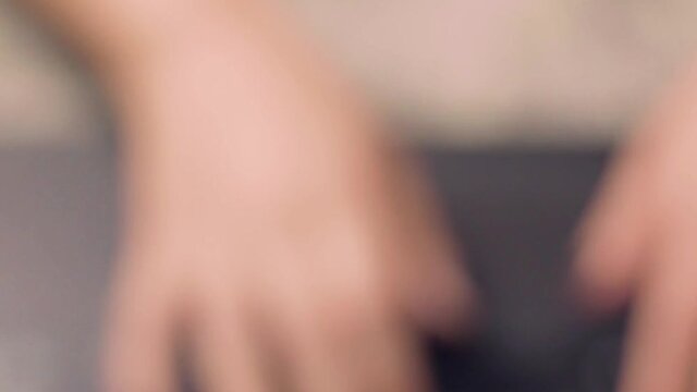 Woman's hand typing on the laptop