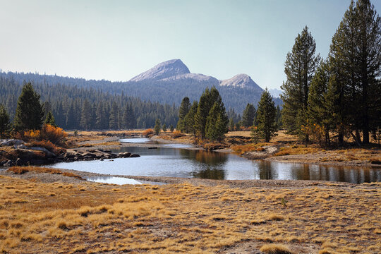 The Tuolumne River is shown in a wide view during an autumn day in California, USA.
