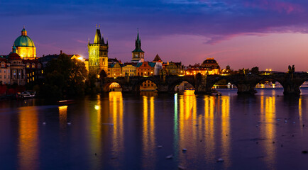Fototapeta na wymiar Picturesque view of city of Prague and Charles Bridge at night, Czech Republic