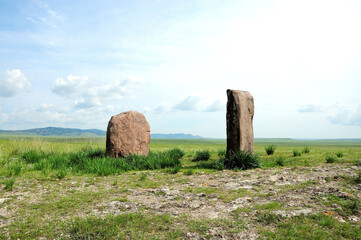 Two ancient sacral stones set in the endless steppe.