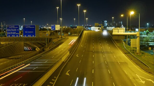 Vehicles Travelling At The N7 Motorway Town Exit In Dublin, Ireland At Night - timelapse