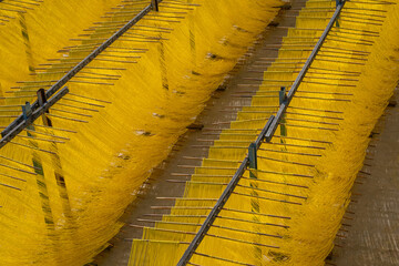 Drying hanging egg noodles handmade from dough to ingredients. The traditional way to dry fine...
