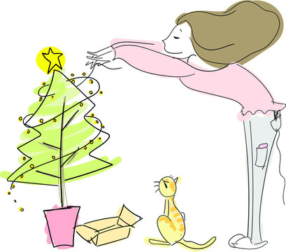 Girl decorating her Christmas tree with her kitty.