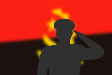 Solder silhouette on blur background with Angola flag.
