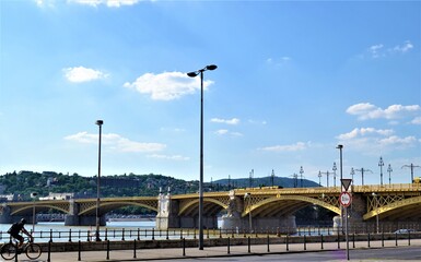 Fototapeta na wymiar Views of Danube River in Budapest. Bridge covers one of the famous River: Danube and separates city as Buda and Pest