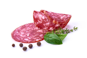Smoked Salami Slices with basil and pepper, isolated on white background