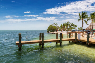 Beautiful beach and pier in tourist resort at sunny day in Florida Keys in Florida, USA.