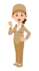 横向きでガッツポーズするベージュ色の作業着の女性
