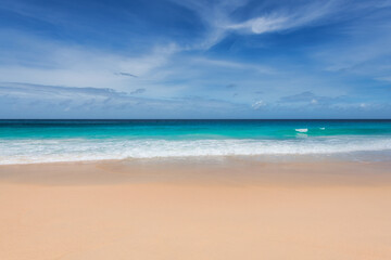 Tropical paradise beach background with warm sand and turquoise sea in paradise island. Tropical beach background.