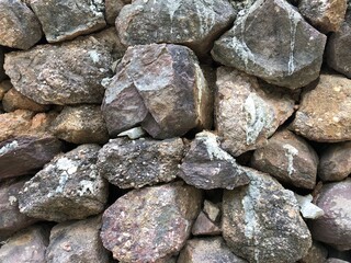abstract background with dry round reeble, pebbles stones wall