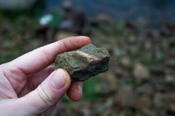 hand holding a stone