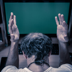 Closeup photo of mans with green chromakey computer screen. Problem with online banking