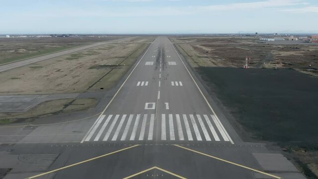 Forward aerial of Keflavik airstrip in Iceland with POV arrival flight line