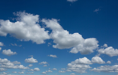 Naklejka na ściany i meble Cumulus Clouds Against Blue Sky for Background 