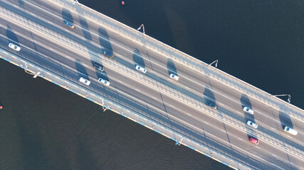 Aerial top view of bridge road automobile traffic of many cars from above, city transportation concept
