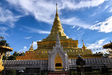 Naklejka premium The Golden Stupa in Lanna architecture style of Wat Phra That Chae Haeng Temple, The iconic destination in Nan Province, Thailand