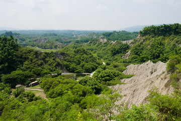 Fototapeta na wymiar Mudstone badland geopark Kaohsiung. Layers of mudstone hills.